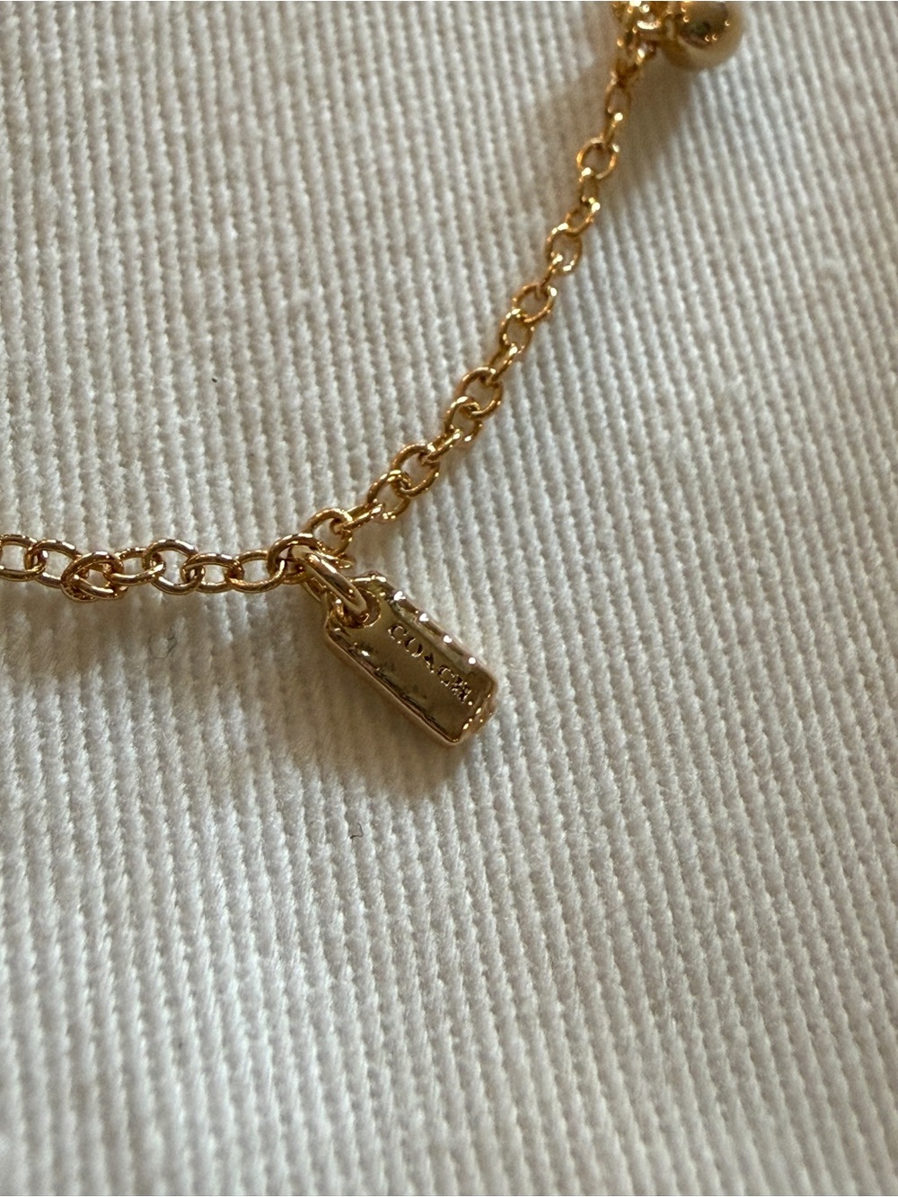 Coach Gold-Tone Charm Bracelet with Chain Detail - Picture 5 of 9